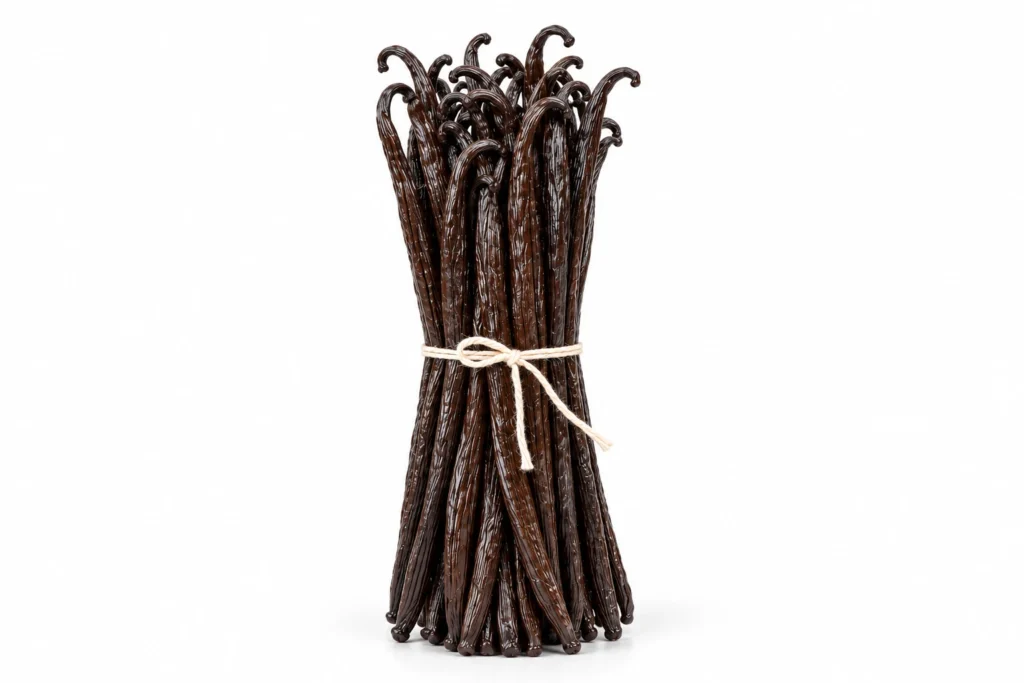 A bundle of glossy dark vanilla beans tied with natural twine on a white background.