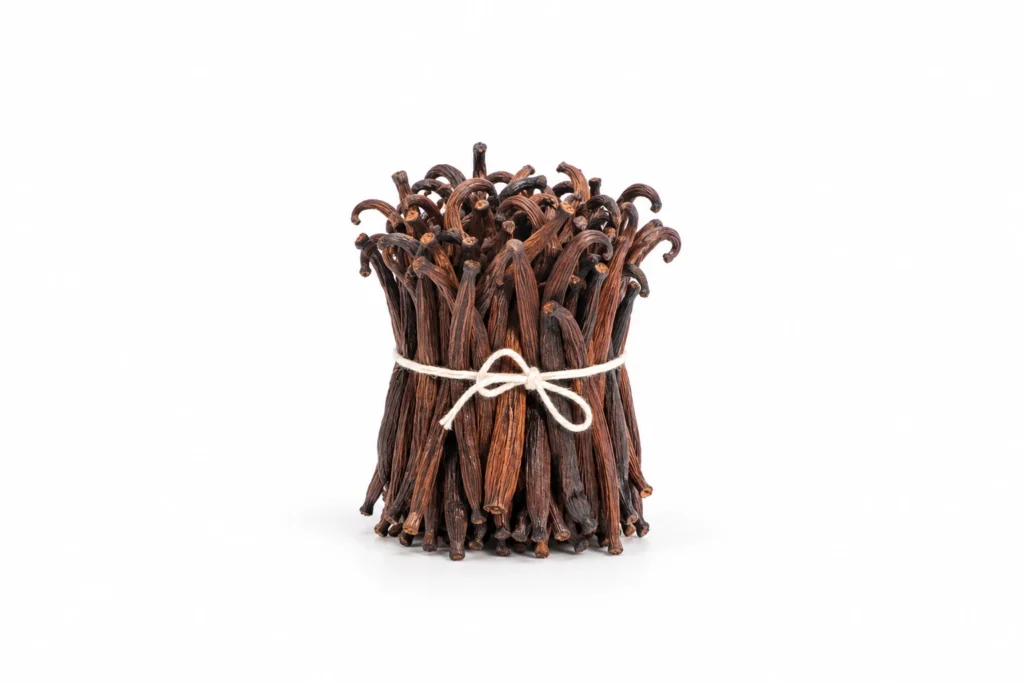 A bundle of short brown vanilla beans, including visible cut ends, tied with twine on a white background.